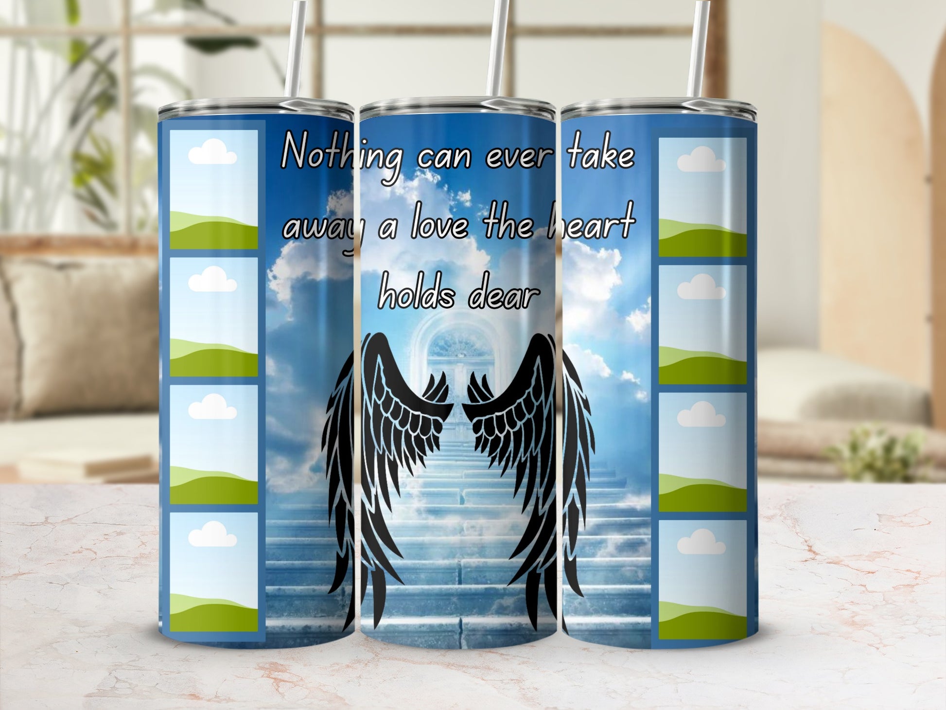 Tumbler with celestial design, angel wings, and text "Nothing can ever take away a love the heart holds dear".