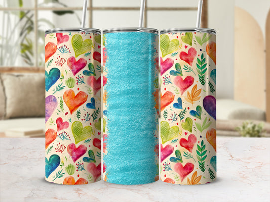 Three tumblers with a colorful heart pattern and a textured blue center.