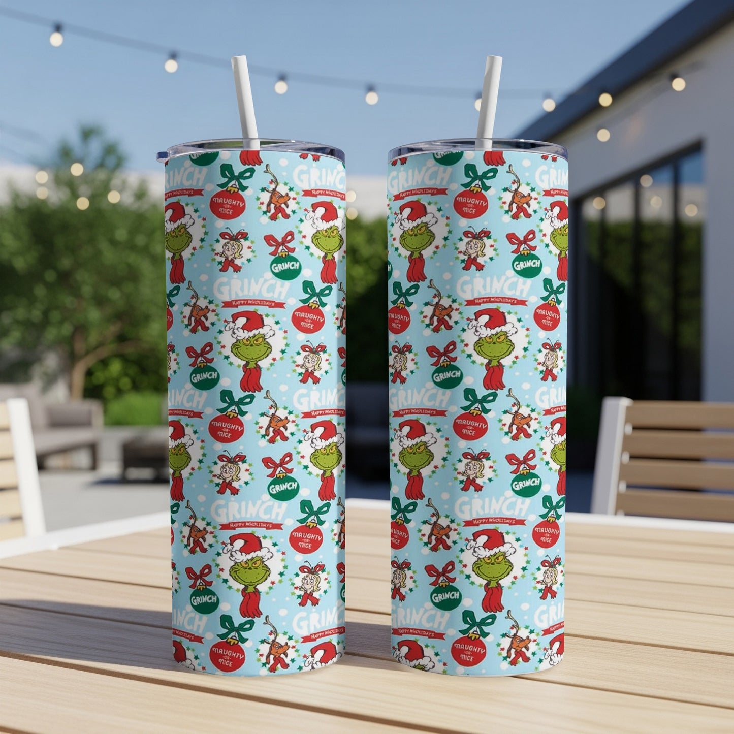 Two Grinch-themed tumblers with holiday patterns and text.