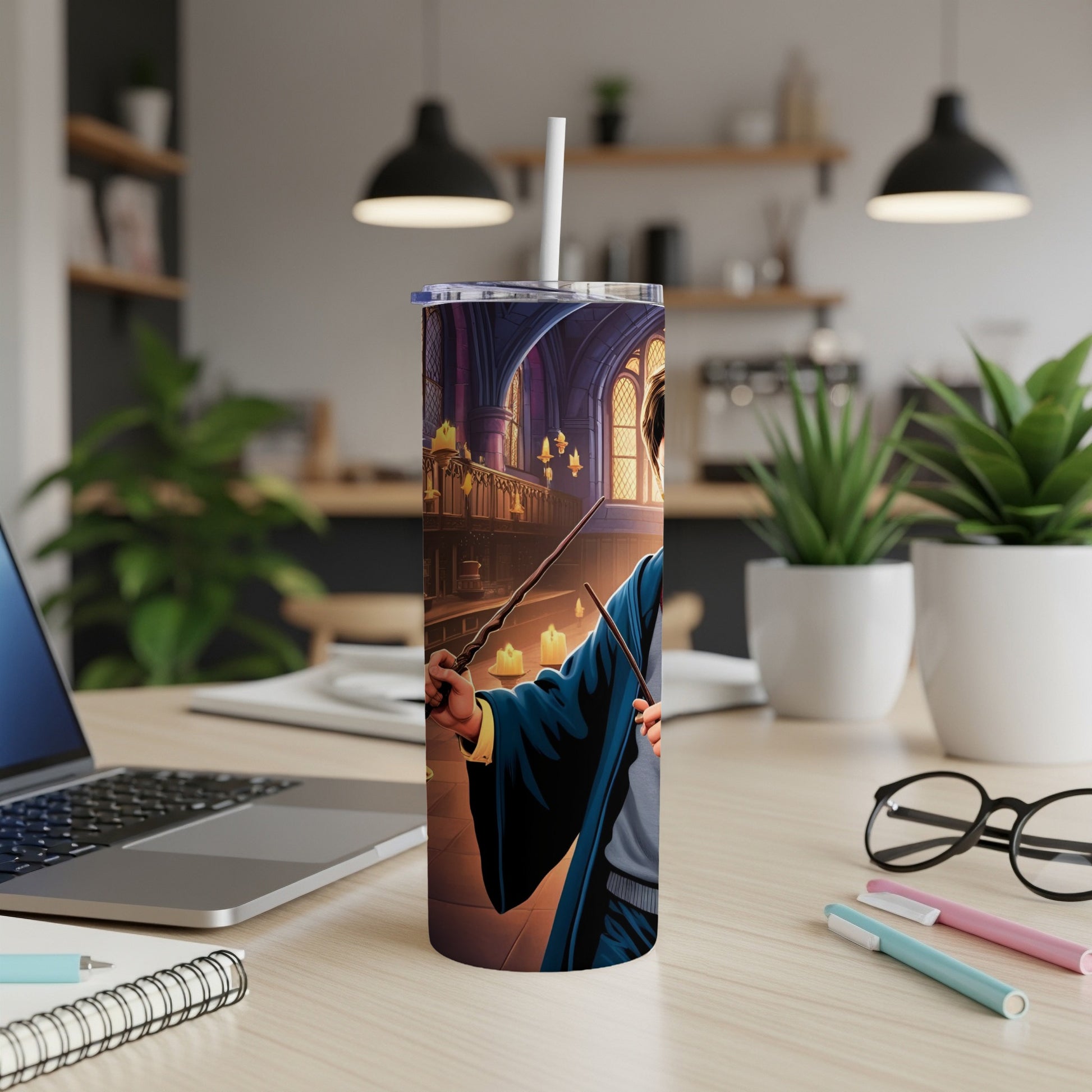 Harry Potter character with wand, on a themed tumbler, on a desk.