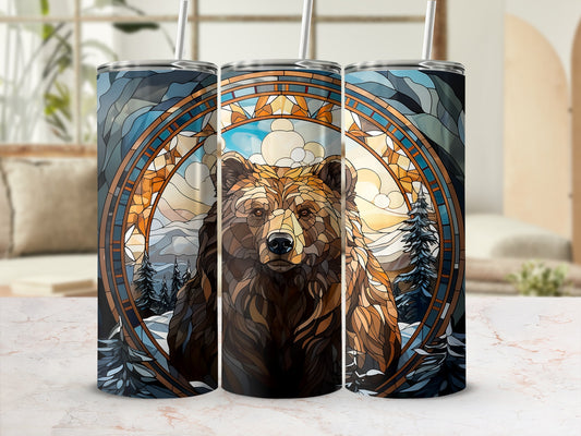 Bear portrait in stained glass circle on a tumbler with straw.