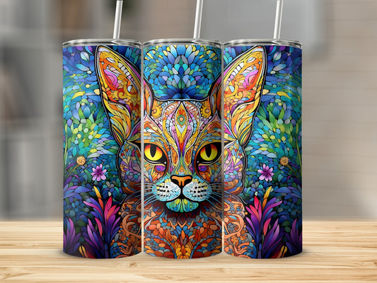 Colorful abstract cat face design on three tumblers with straws.