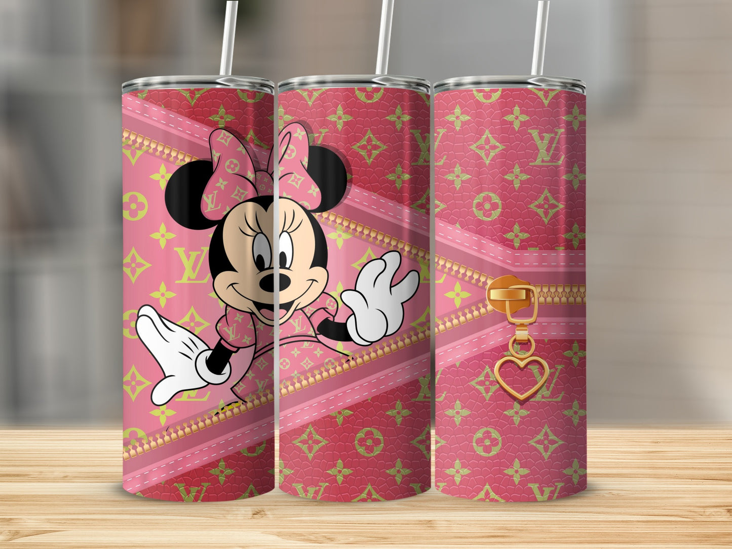 Minnie Mouse on a pink tumbler with gold zipper and heart charm.