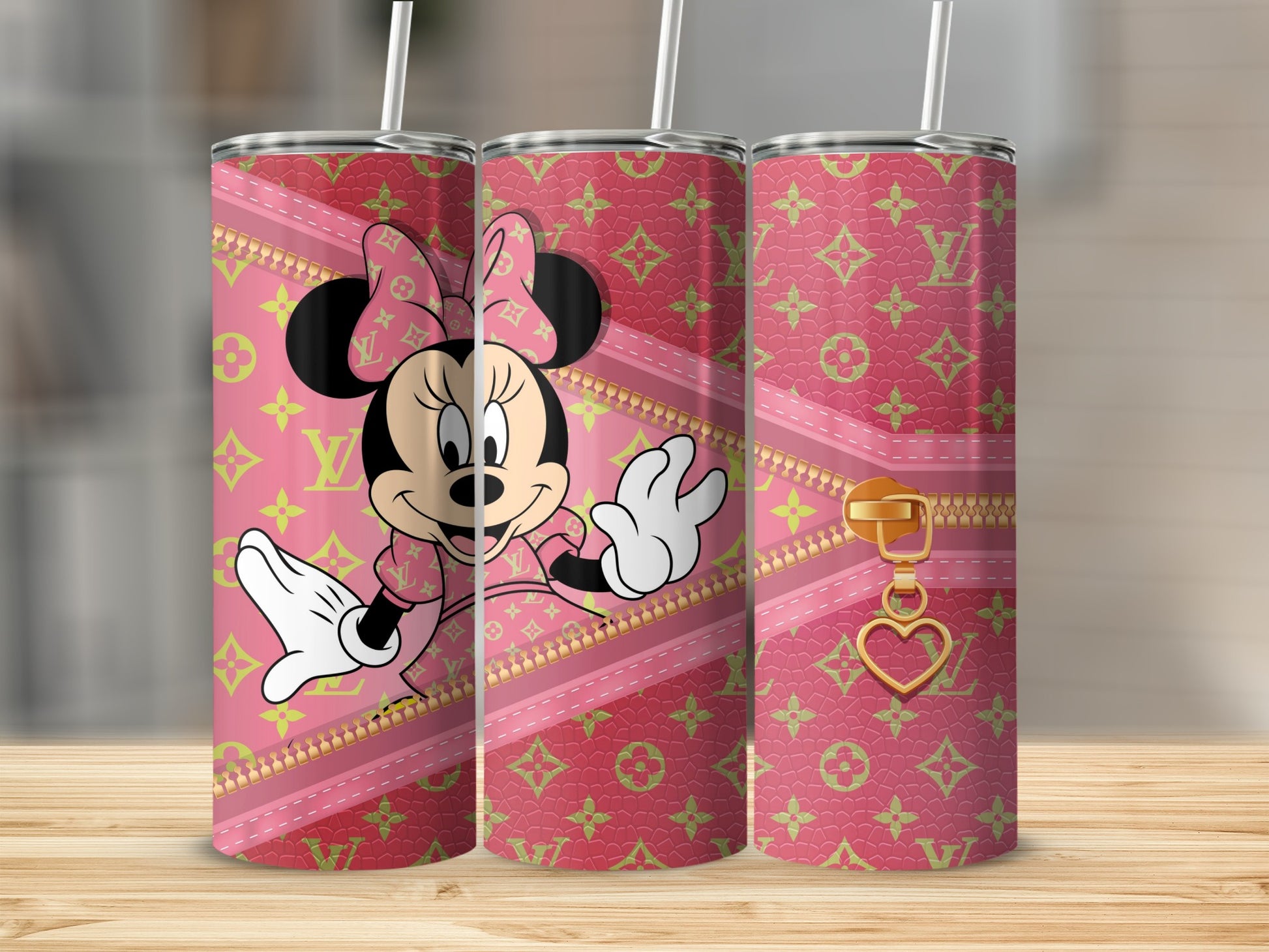 Minnie Mouse on a pink tumbler with gold zipper and heart charm.