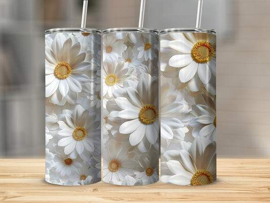 Three tumblers with a white daisy floral pattern, displayed on a wooden surface.