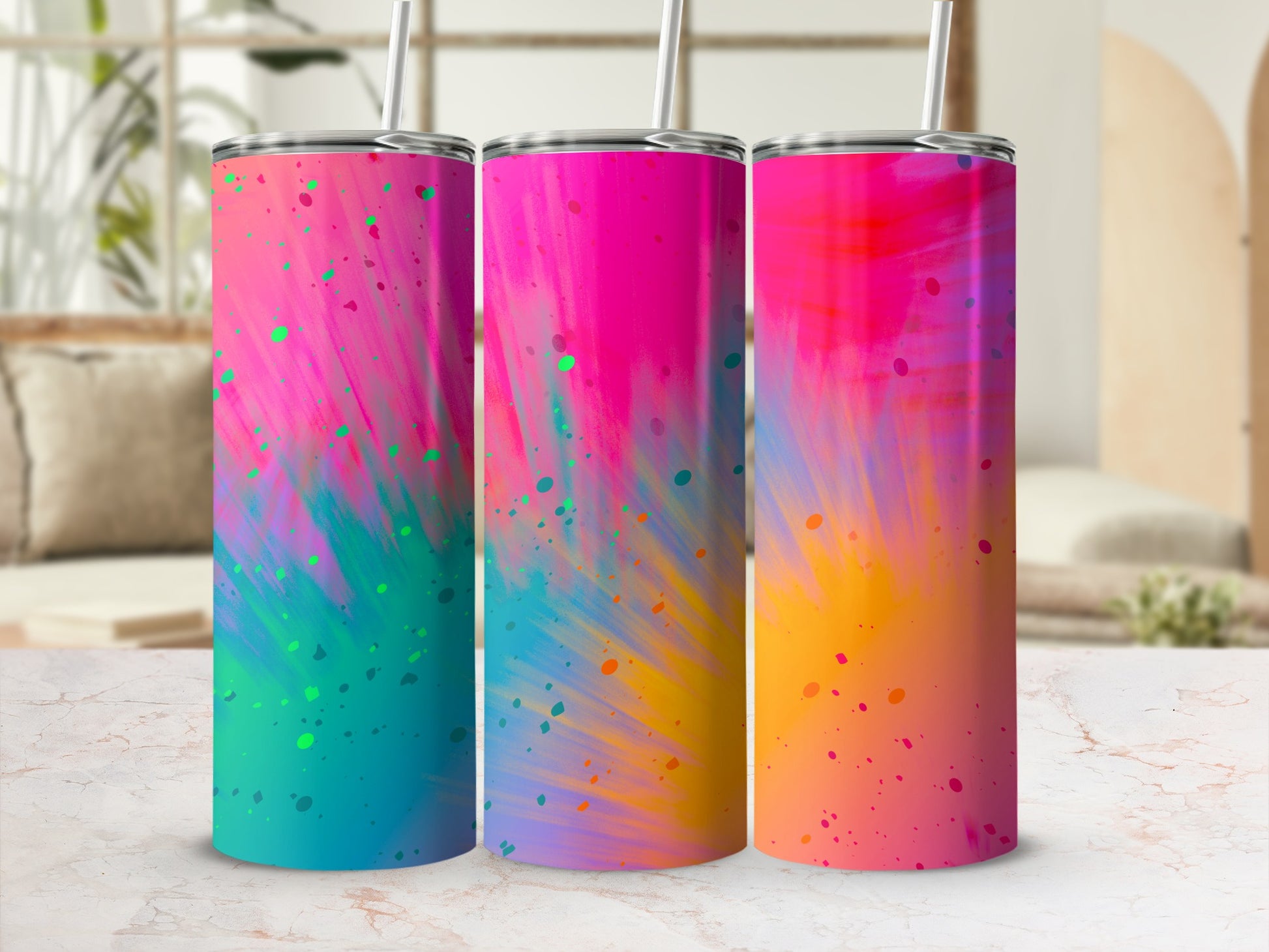 Three tumblers with a vibrant pink, blue, and yellow abstract splatter design.
