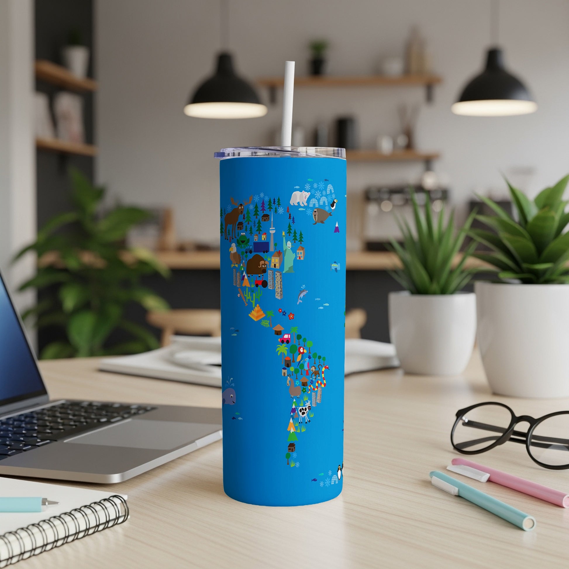Bright blue tumbler with cartoon animals and landmarks forming Americas map.