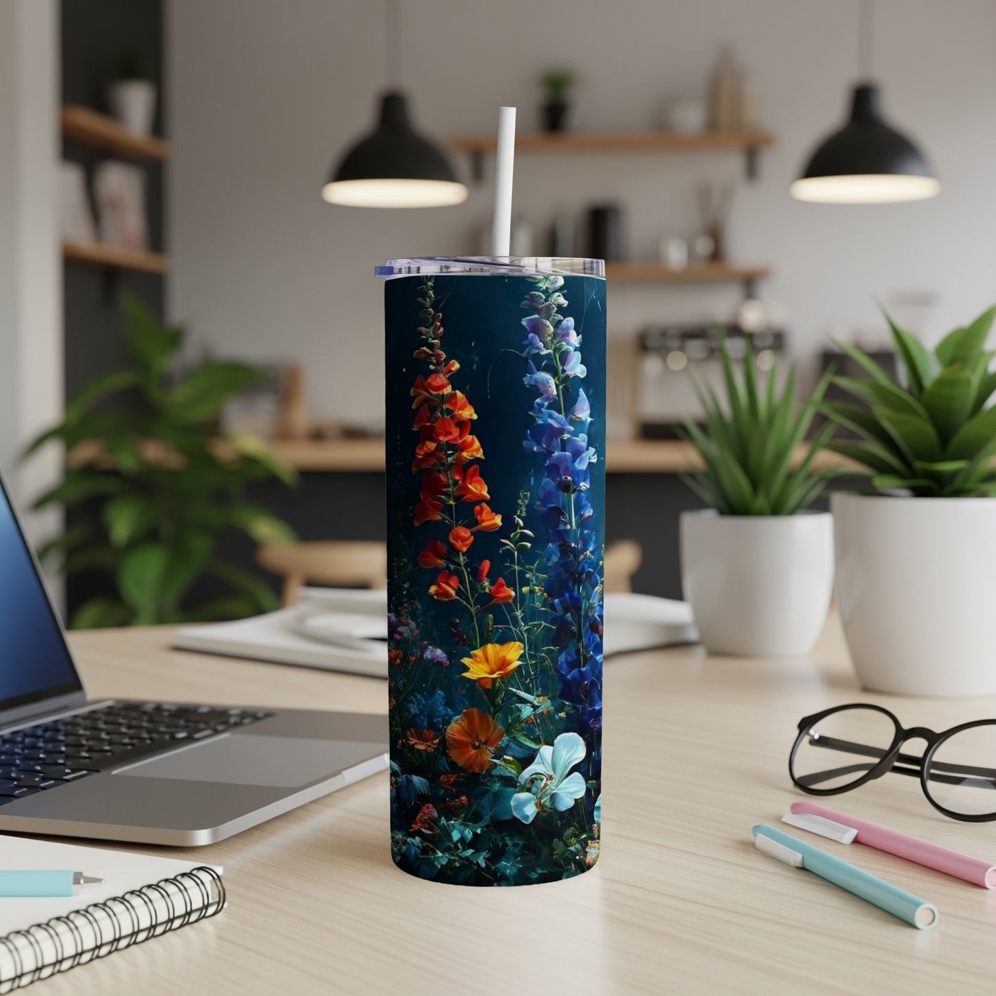 Tall tumbler with colorful floral and underwater plant design.