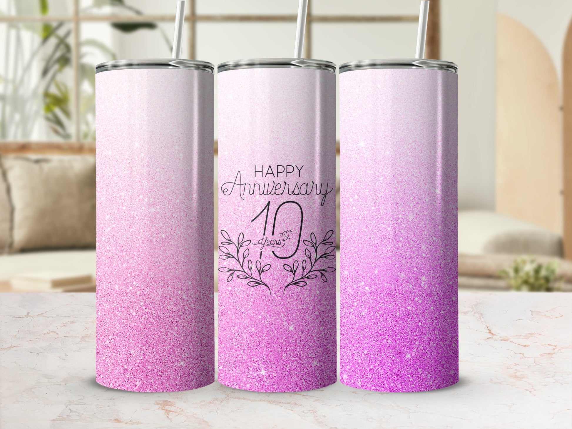 Pink glitter tumbler with "Happy Anniversary 10 Years" text.