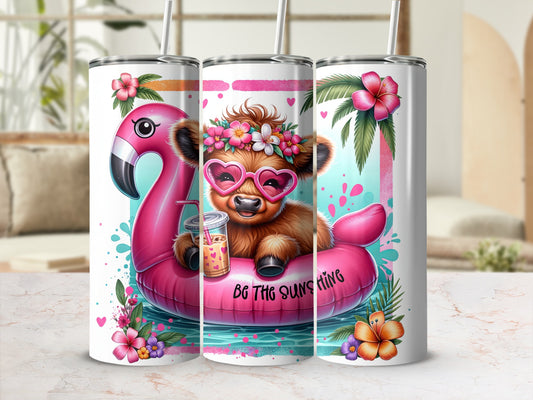 Cow wearing flower crown and sunglasses on flamingo float, "Be the Sunshine" text.