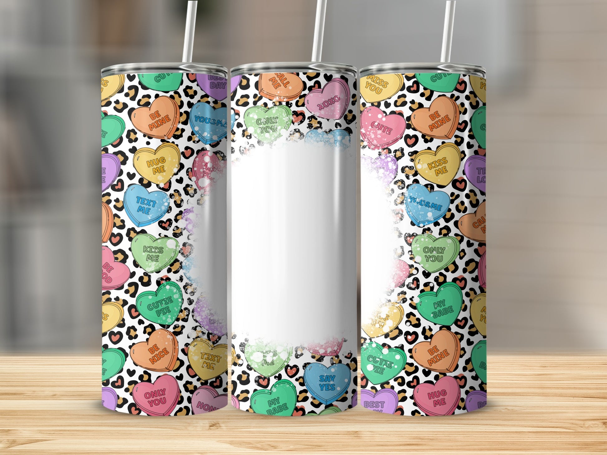 Tumbler with leopard print and Valentine's Day heart designs.