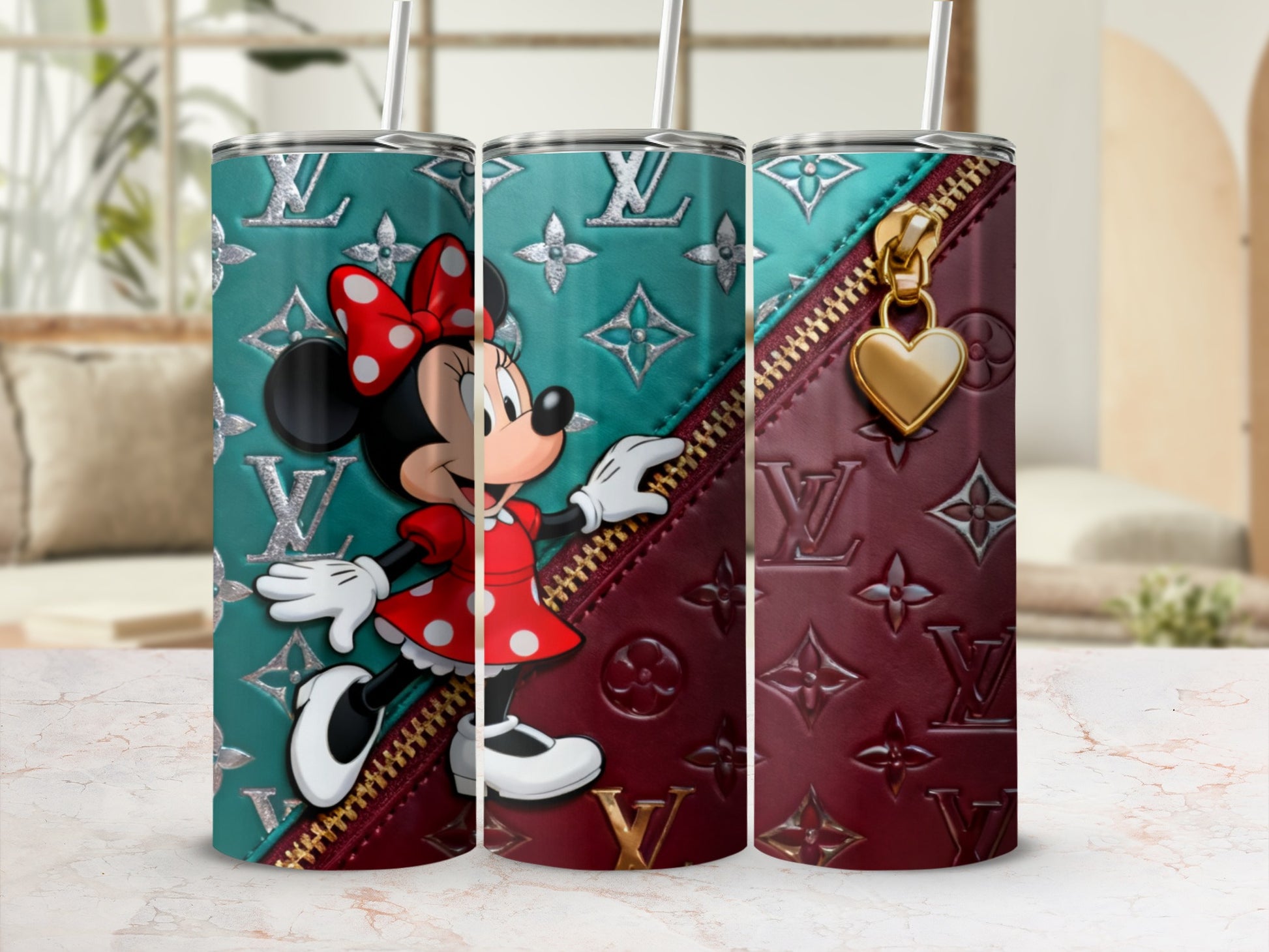 Minnie Mouse on a burgundy and teal patterned tumbler with gold zipper accent.