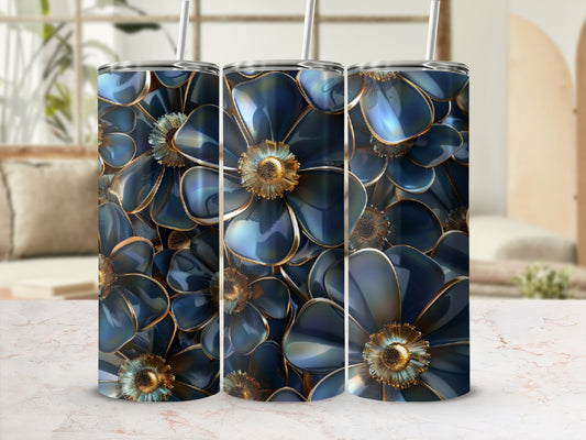 Three blue floral tumblers with gold centers and straws.