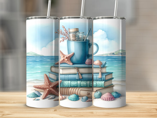 Stack of books with seashells and starfish, topped with a mug and straw.