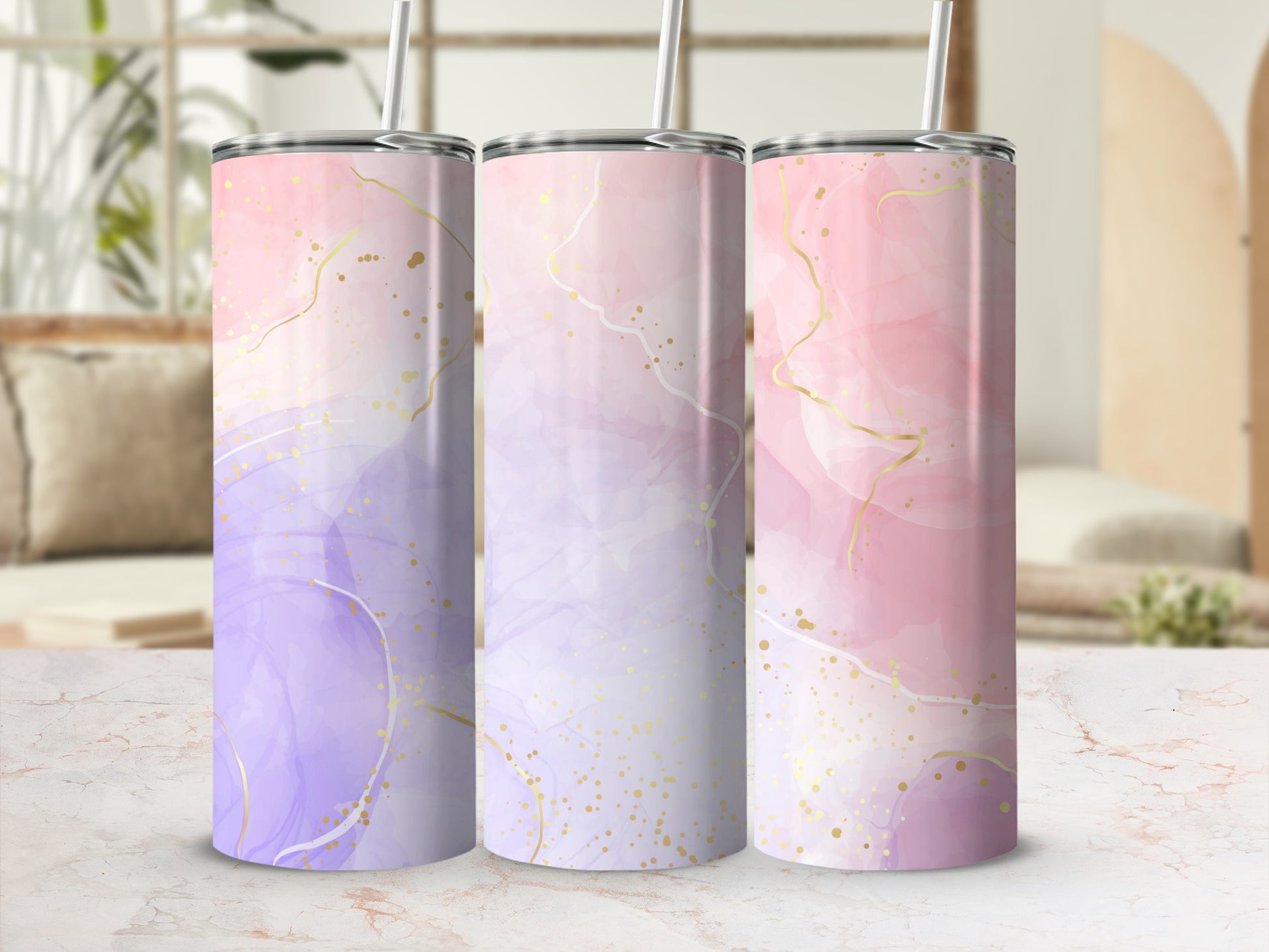 Three tumblers with abstract marble and gold glitter design.