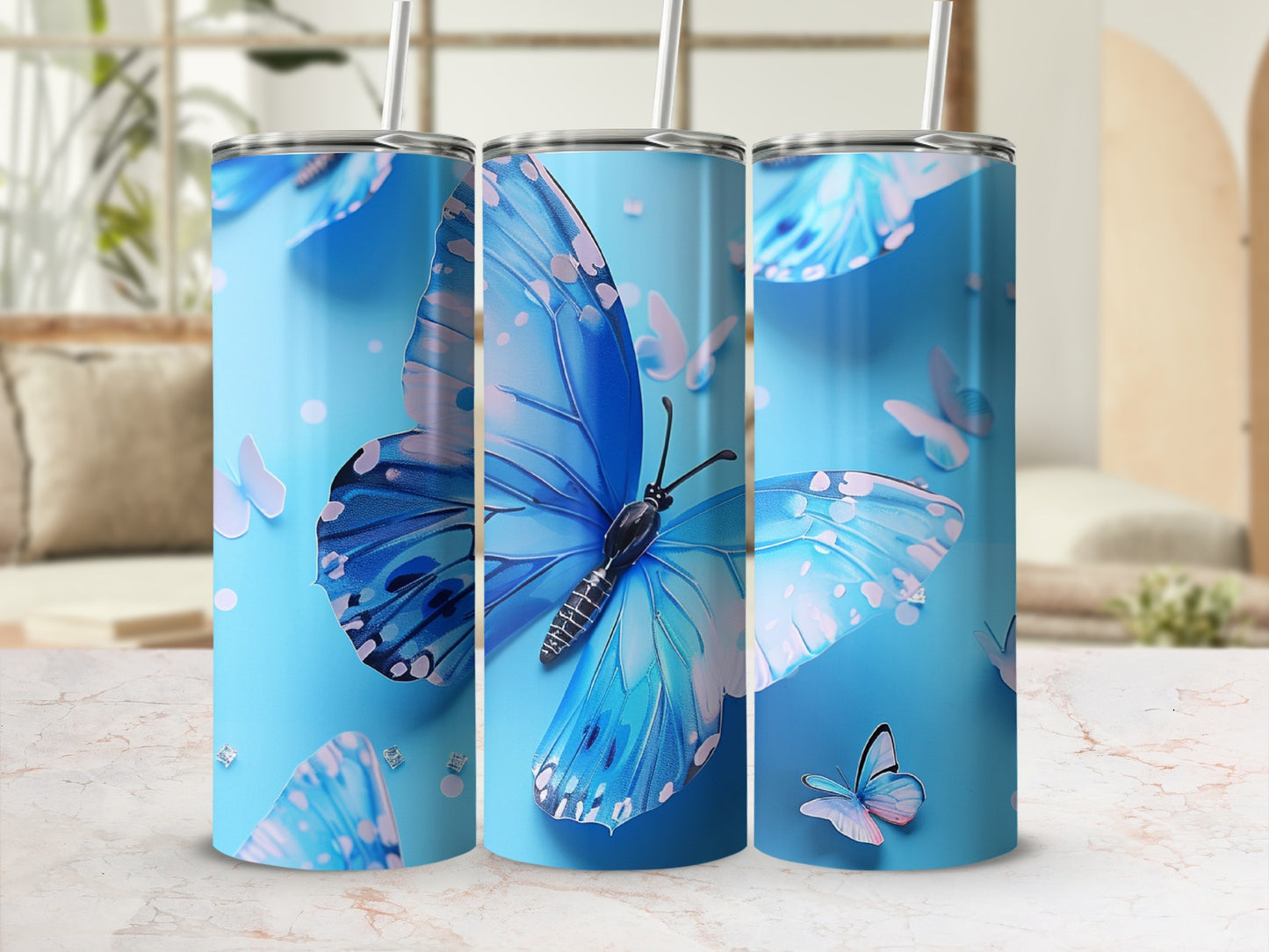 Blue butterfly pattern on a skinny tumbler with a straw.