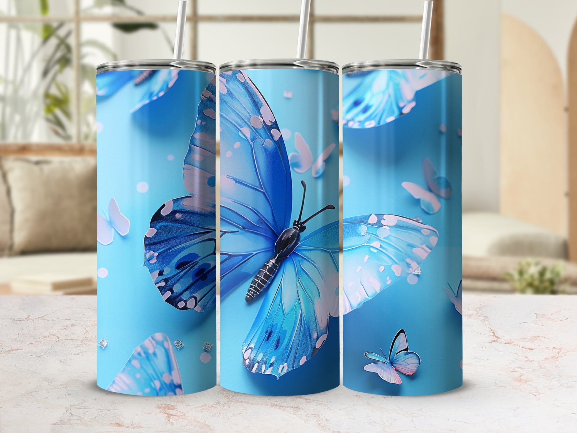 Blue butterfly pattern on a skinny tumbler with a straw.
