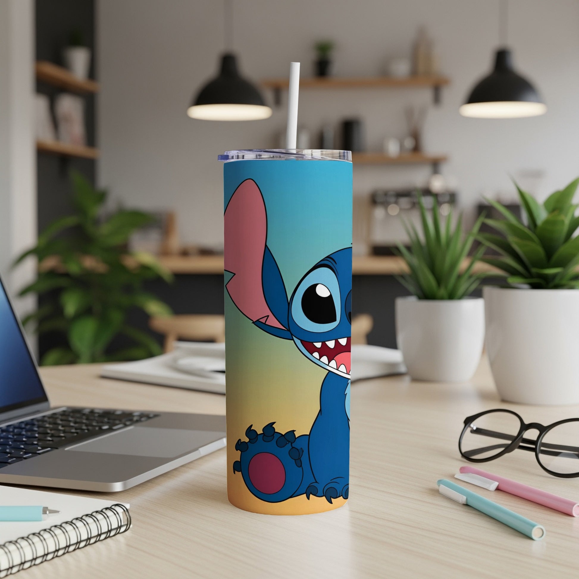 Blue Stitch character on a gradient tumbler with a straw.
