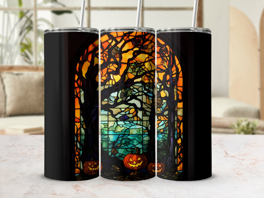 Three tumblers with a stained-glass pumpkin and tree Halloween design.