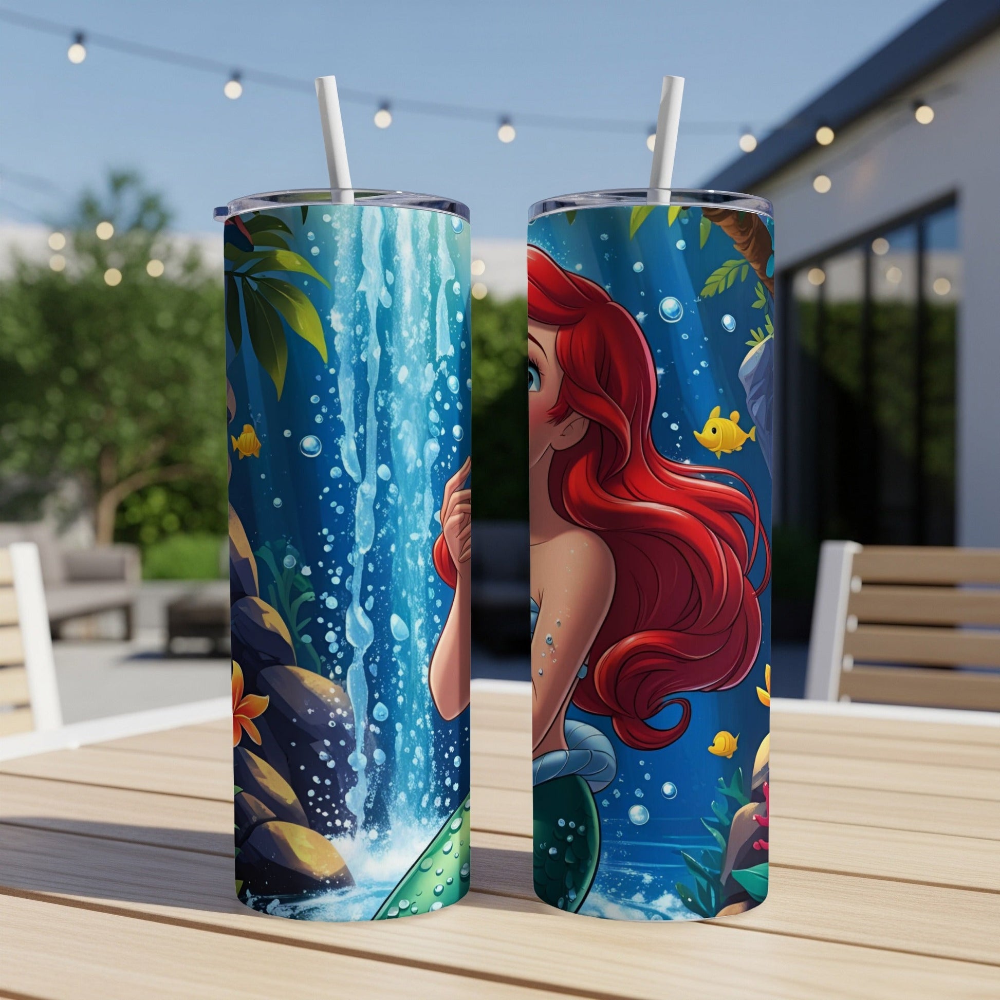Ariel the mermaid peeks from behind a waterfall with colorful fish.