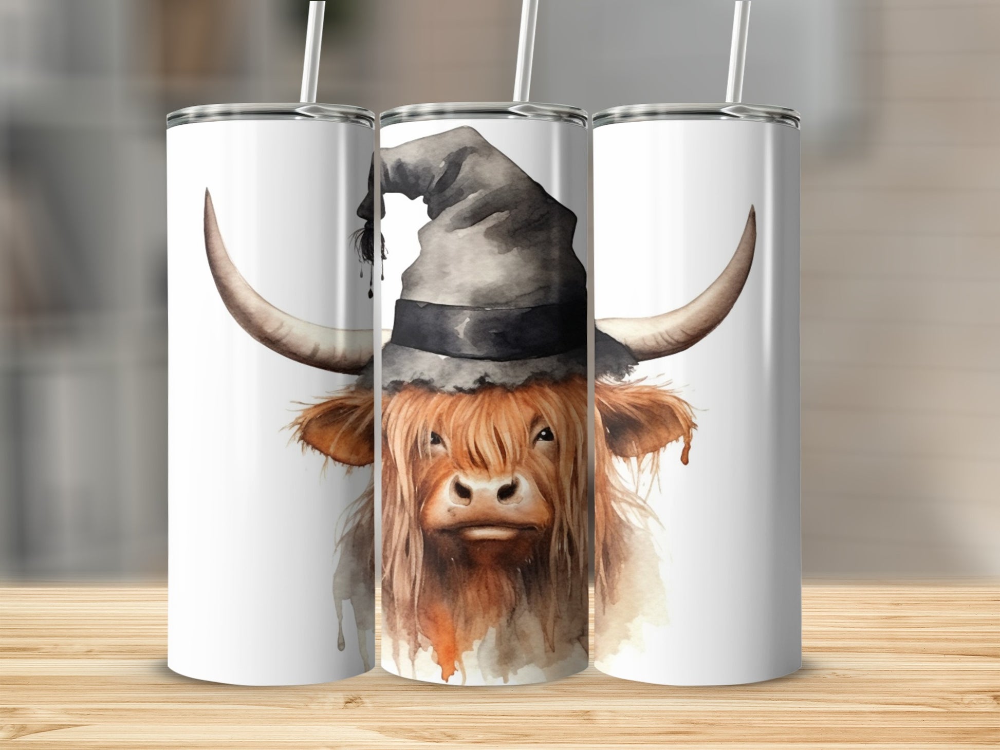 Highland cow in witch hat on a white tumbler.