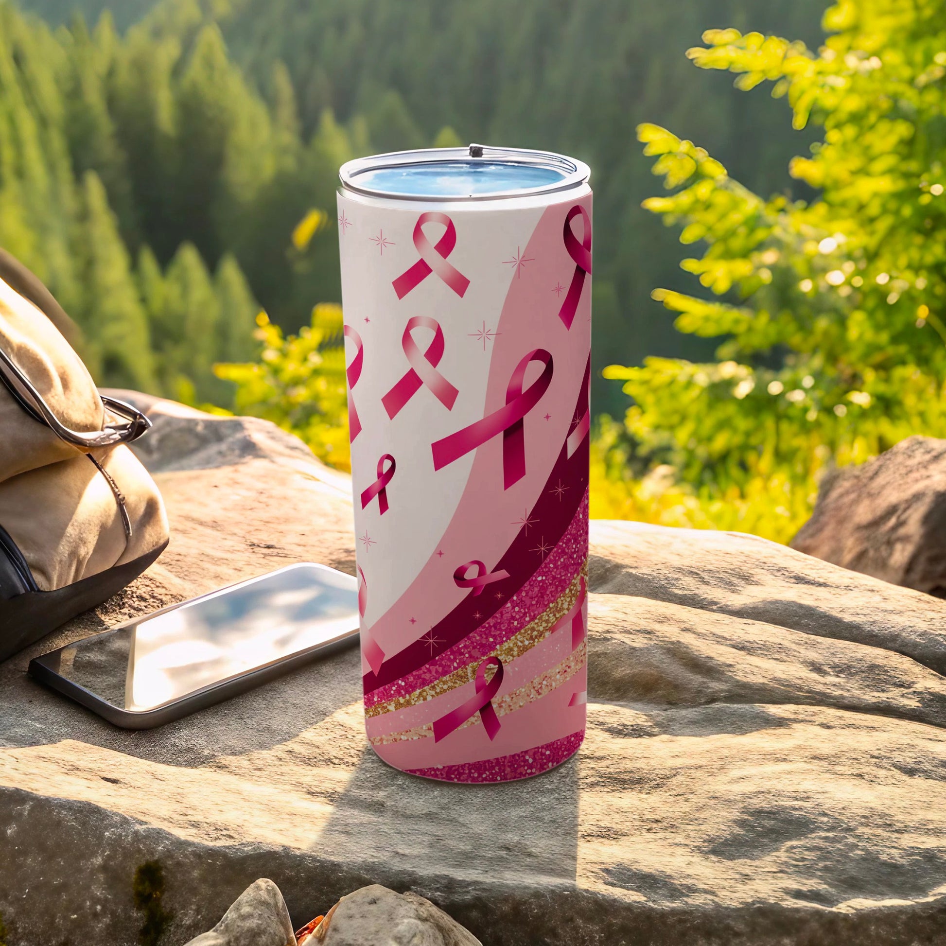 Pink breast cancer awareness ribbons on a speckled pink tumbler.