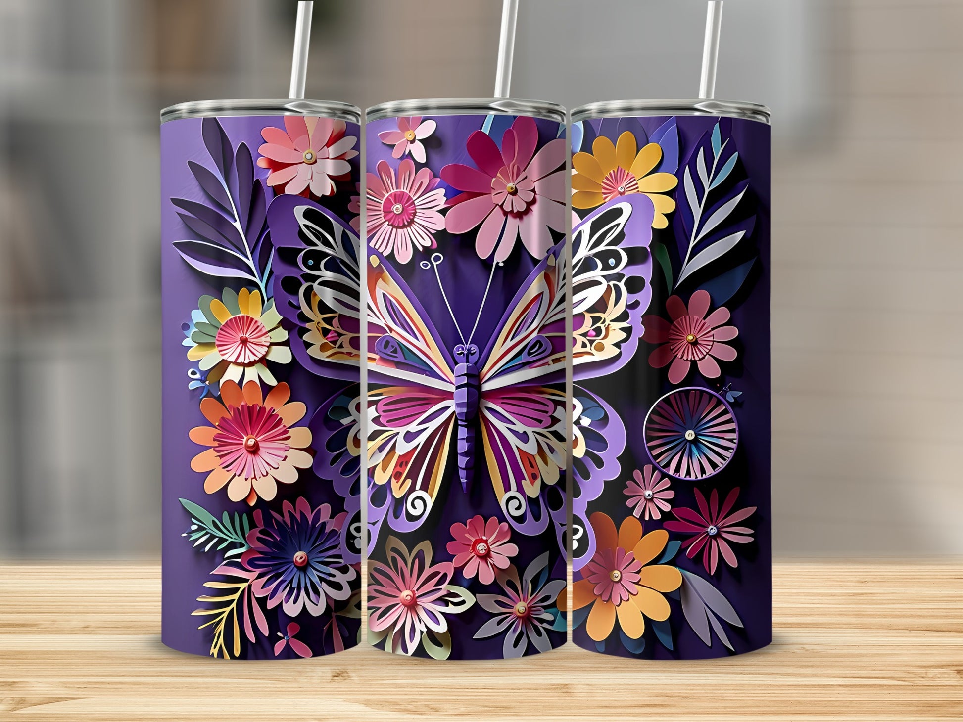 Three purple tumblers with colorful butterfly and floral designs, each with a straw.