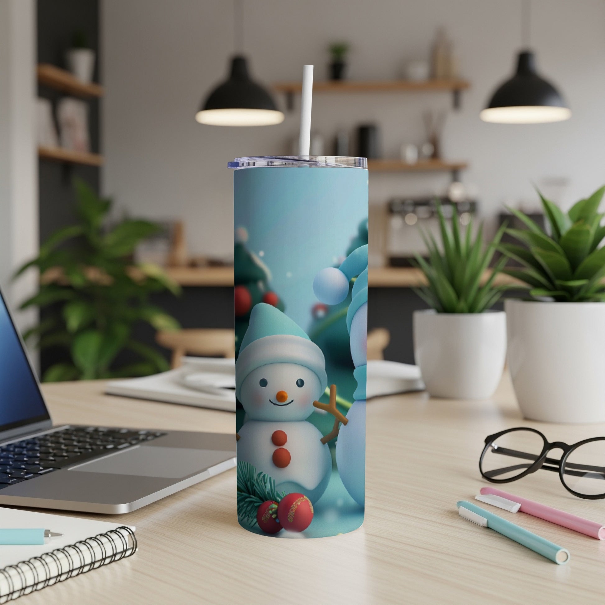Tumbler with cheerful snowmen in a winter scene with trees and ornaments.