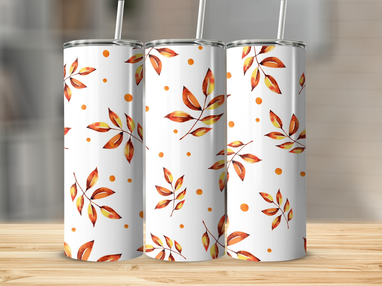 Three white tumblers with a fall leaf and dot pattern.