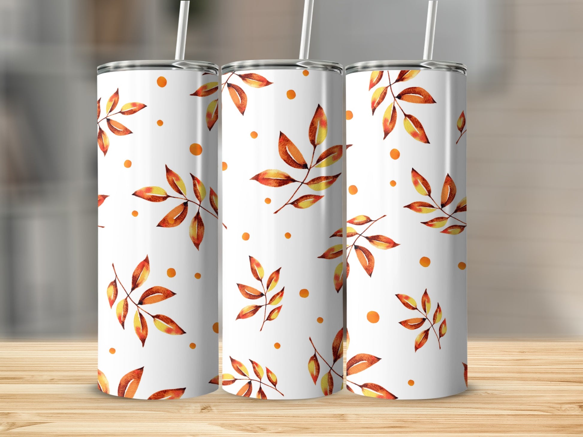 Three white tumblers with a fall leaf and dot pattern.