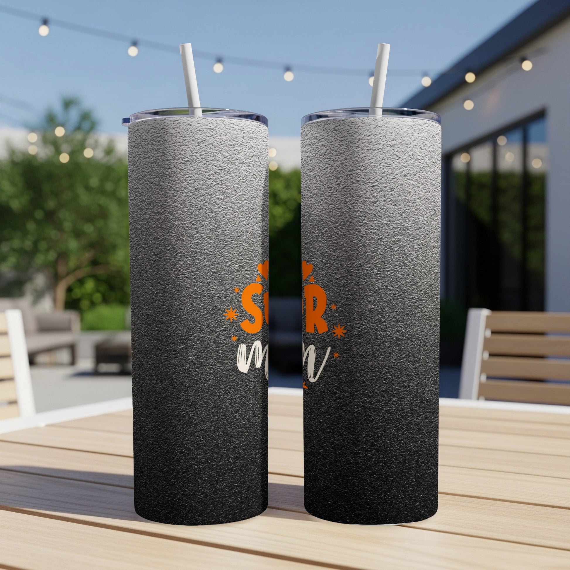 Black and white ombre tumbler with "Star Mom" in orange text.