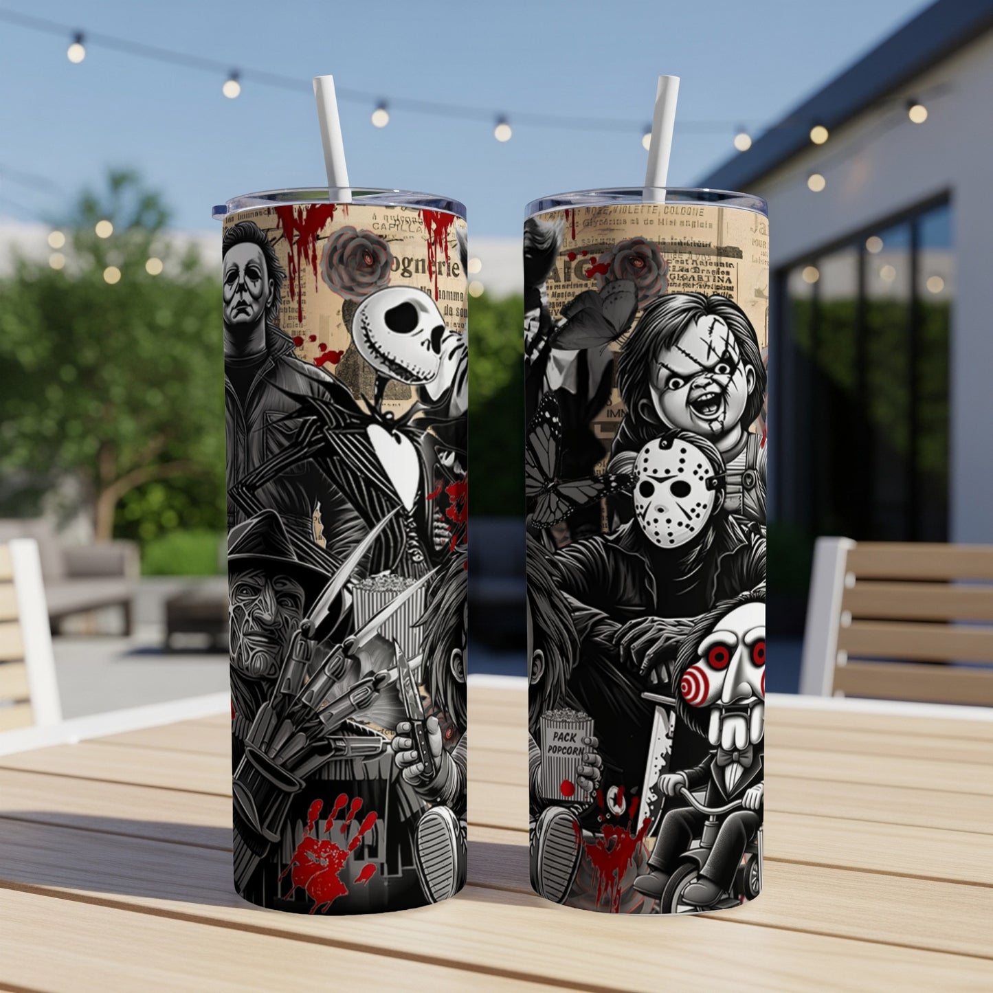 Two horror-themed tumblers featuring iconic movie characters on a table.