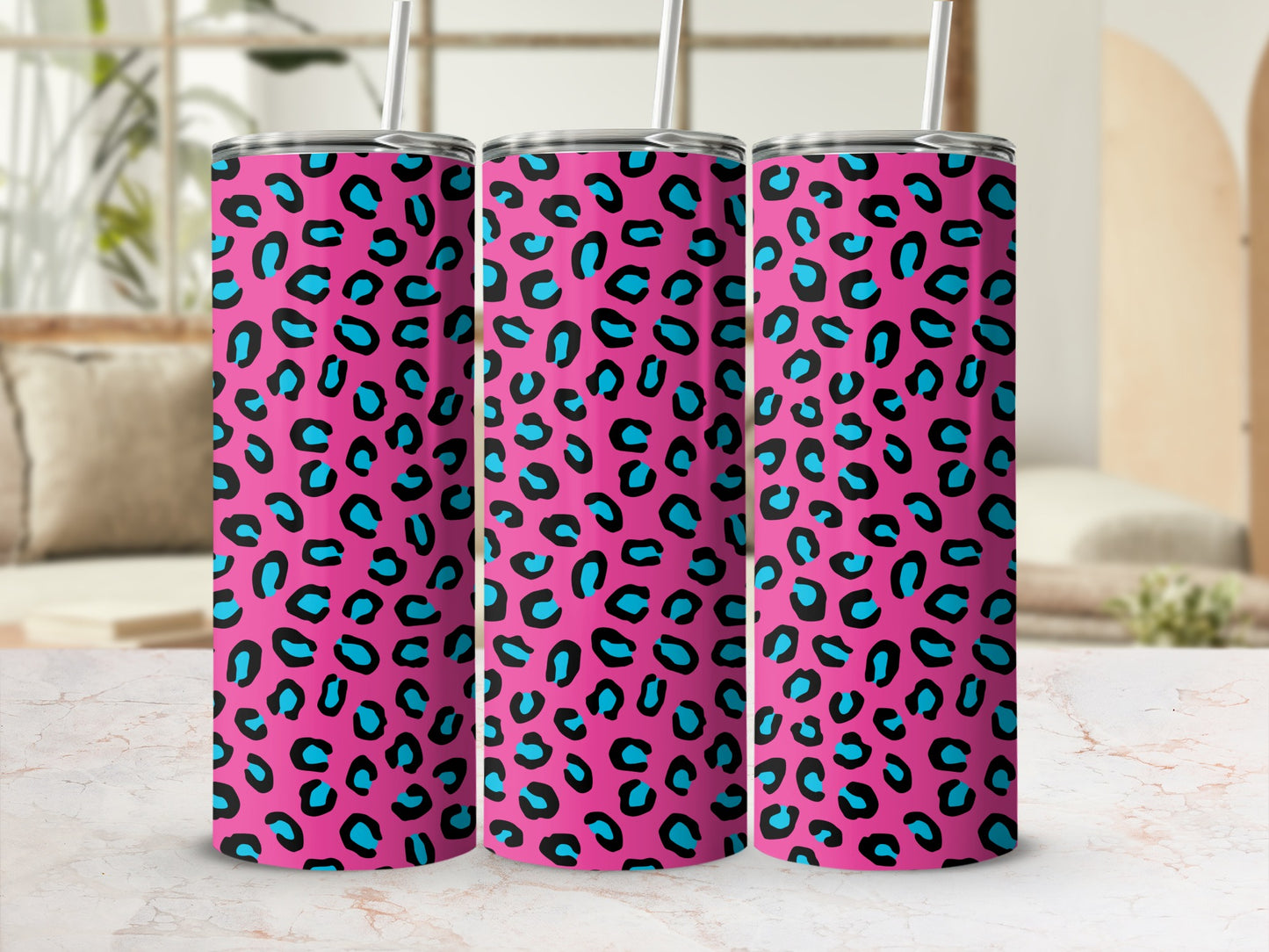 Three tumblers with a hot pink, black, and turquoise leopard print pattern.