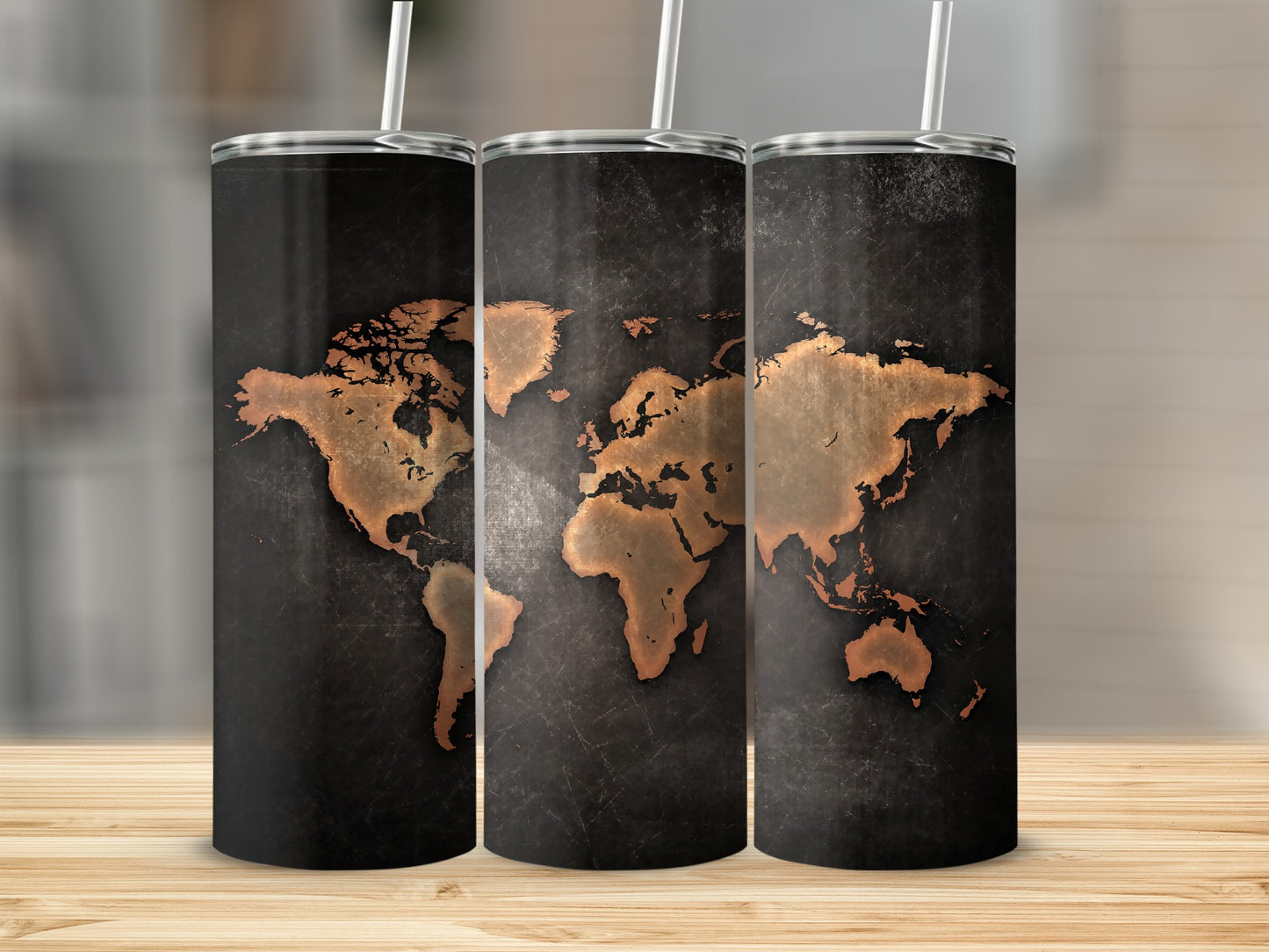 Three tumblers with a dark, textured background and a copper world map design.