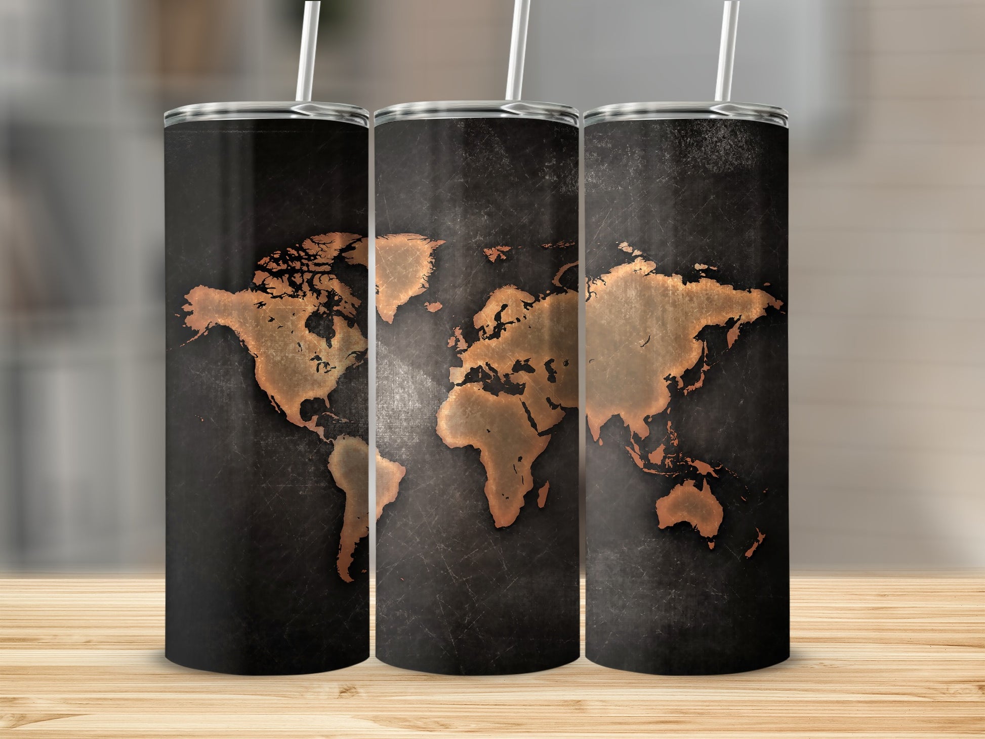 Three tumblers with a dark, textured background and a copper world map design.