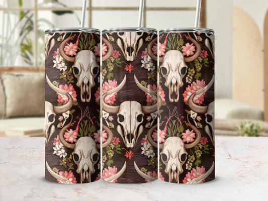 Cow skull and floral pattern on a tumbler with straw.