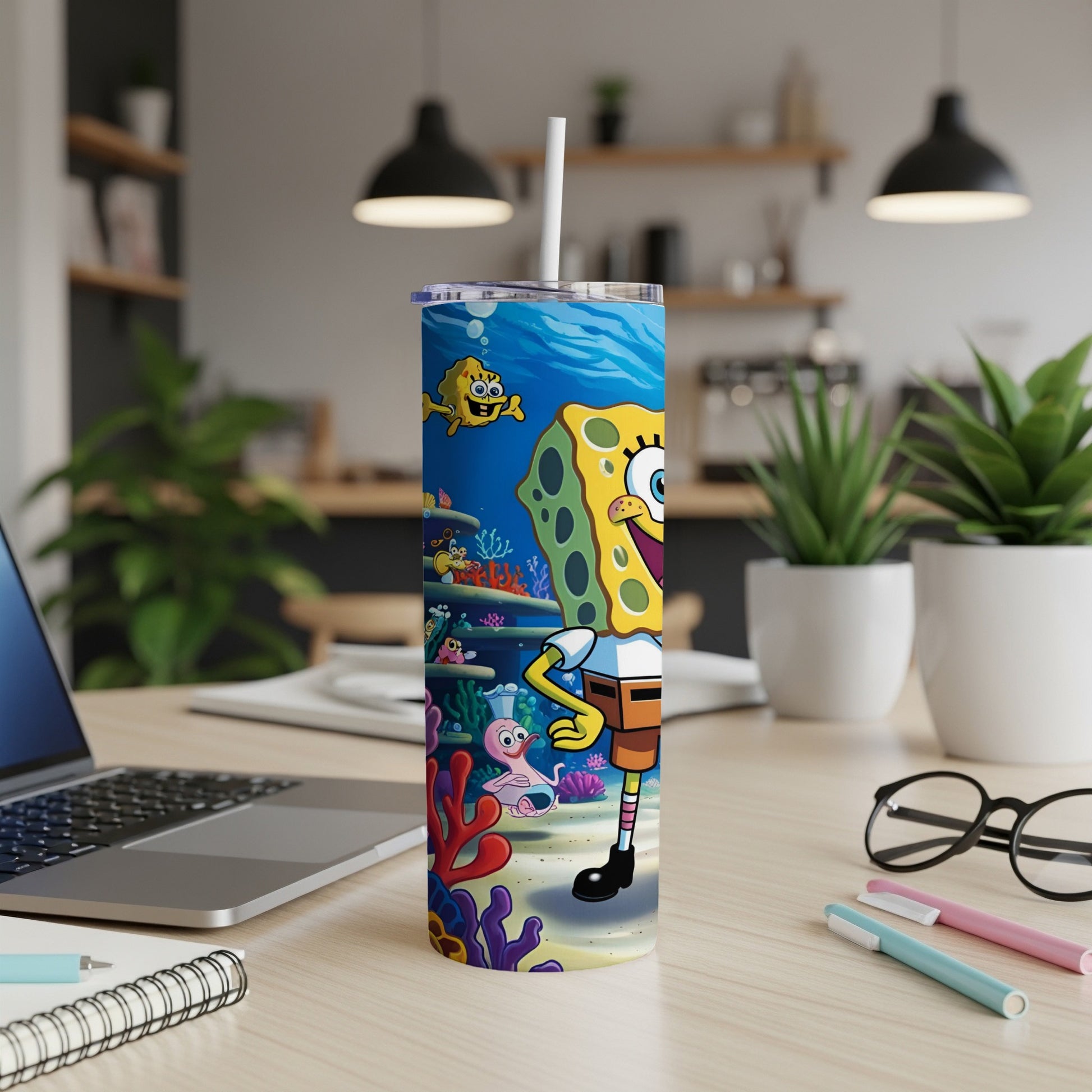 SpongeBob SquarePants character artwork on a blue and coral patterned tumbler.