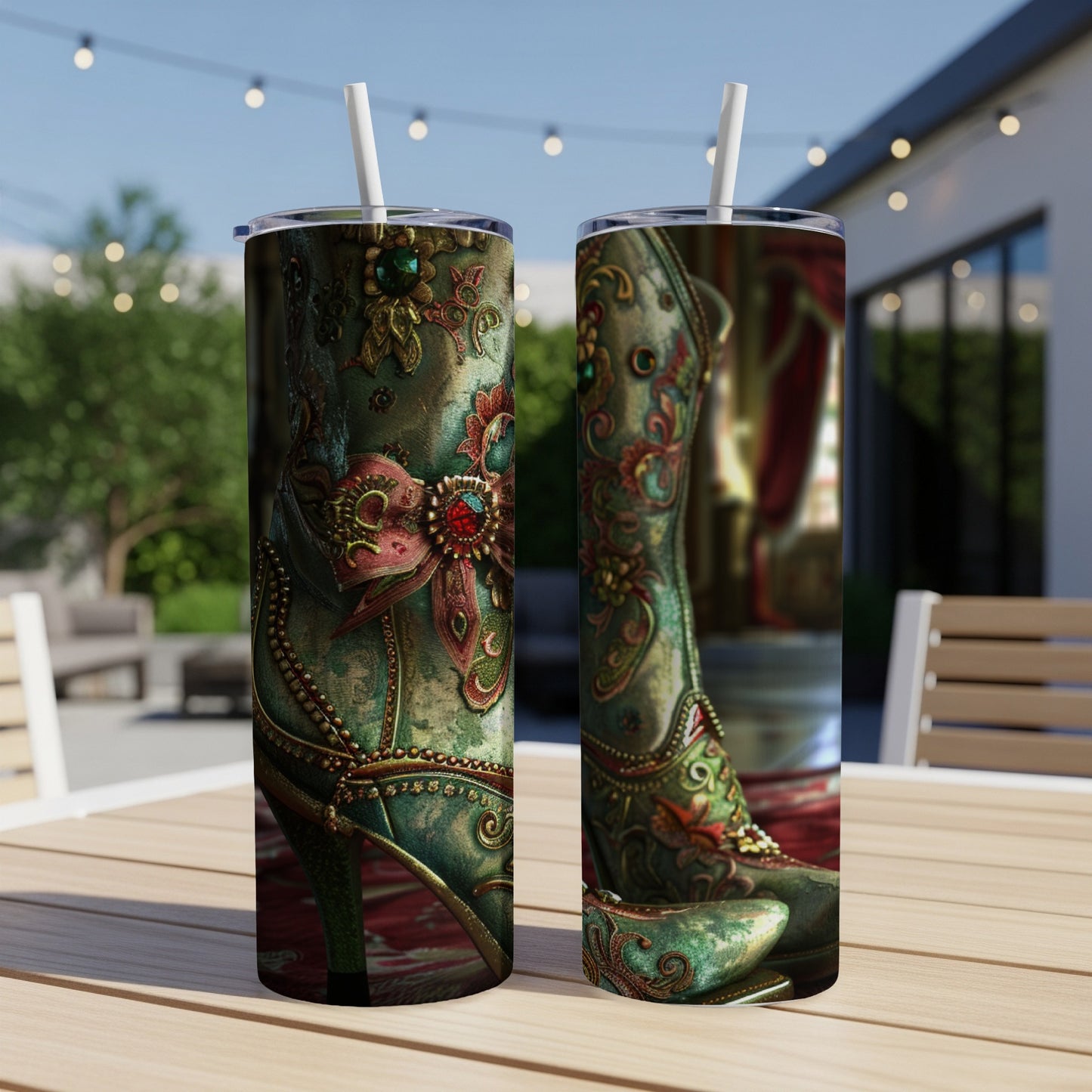 Ornate teal boots with red embellishments displayed on a table.