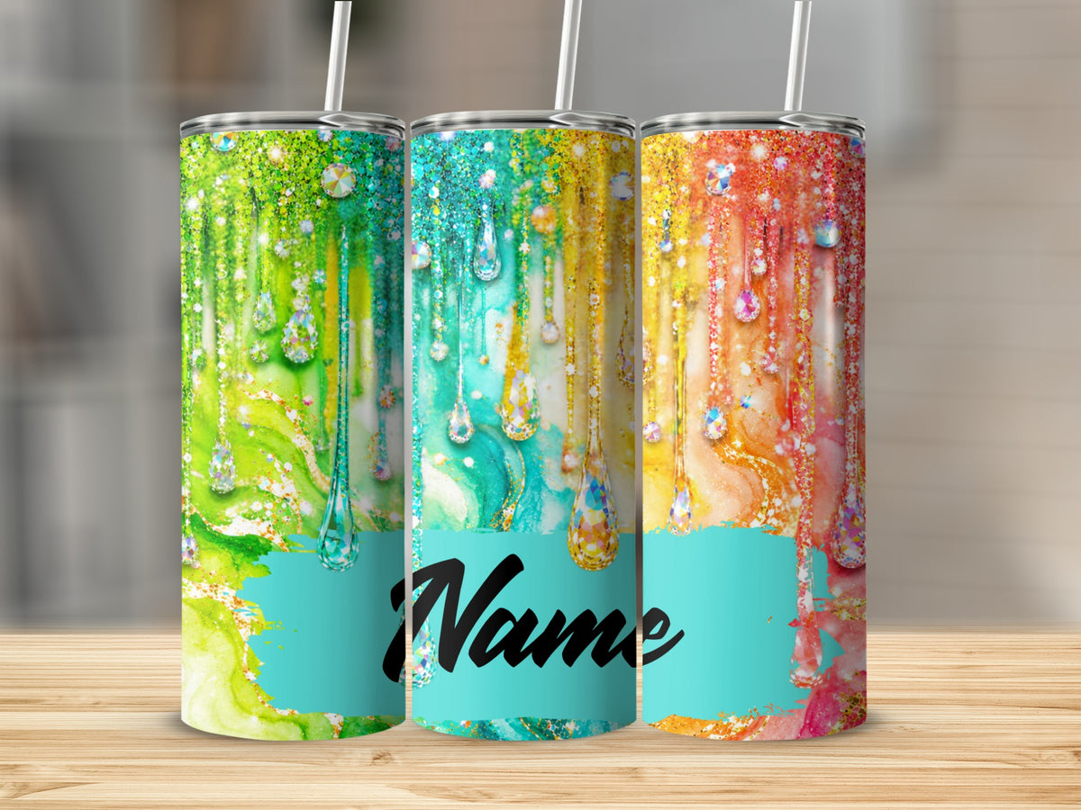 Three tumblers with colorful marbled designs and gemstone drips.