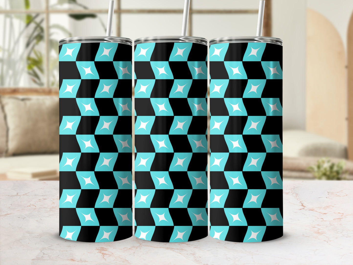 Three tall tumblers with a black and teal geometric pattern.