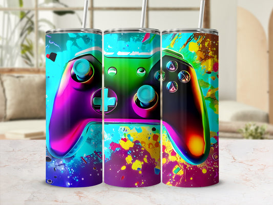 Colorful video game controller design on three tumblers against a blurred background.