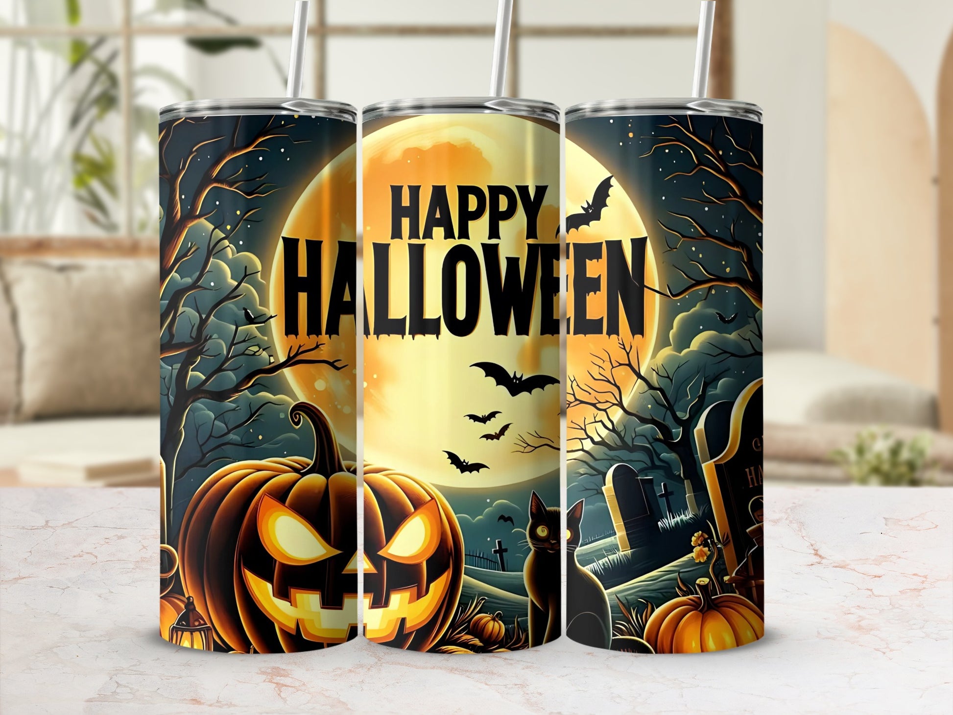 Three Halloween tumblers with jack-o'-lantern, black cat, bats, and tombstone designs.