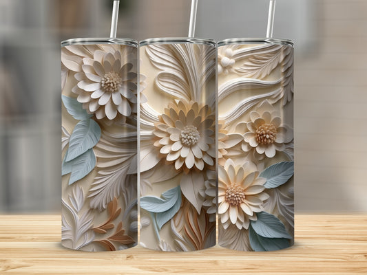 Three tumblers with embossed floral designs on a wooden surface.