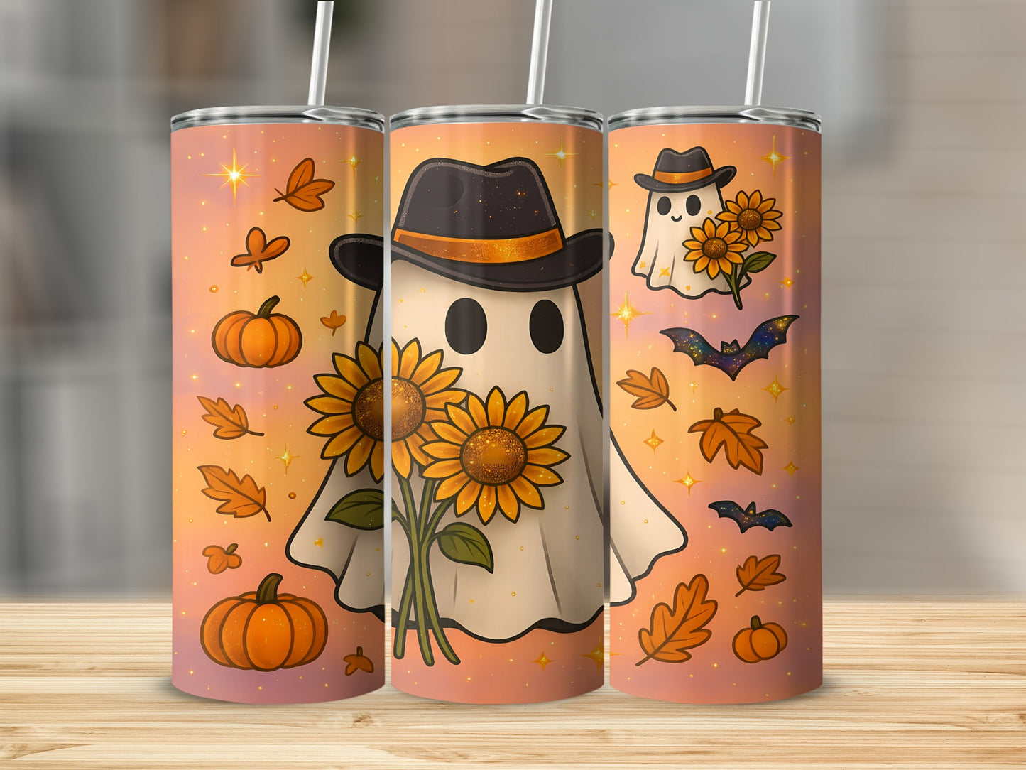 Three tumblers with a Halloween and autumn theme, featuring ghosts, sunflowers, pumpkins, bats, and leaves.