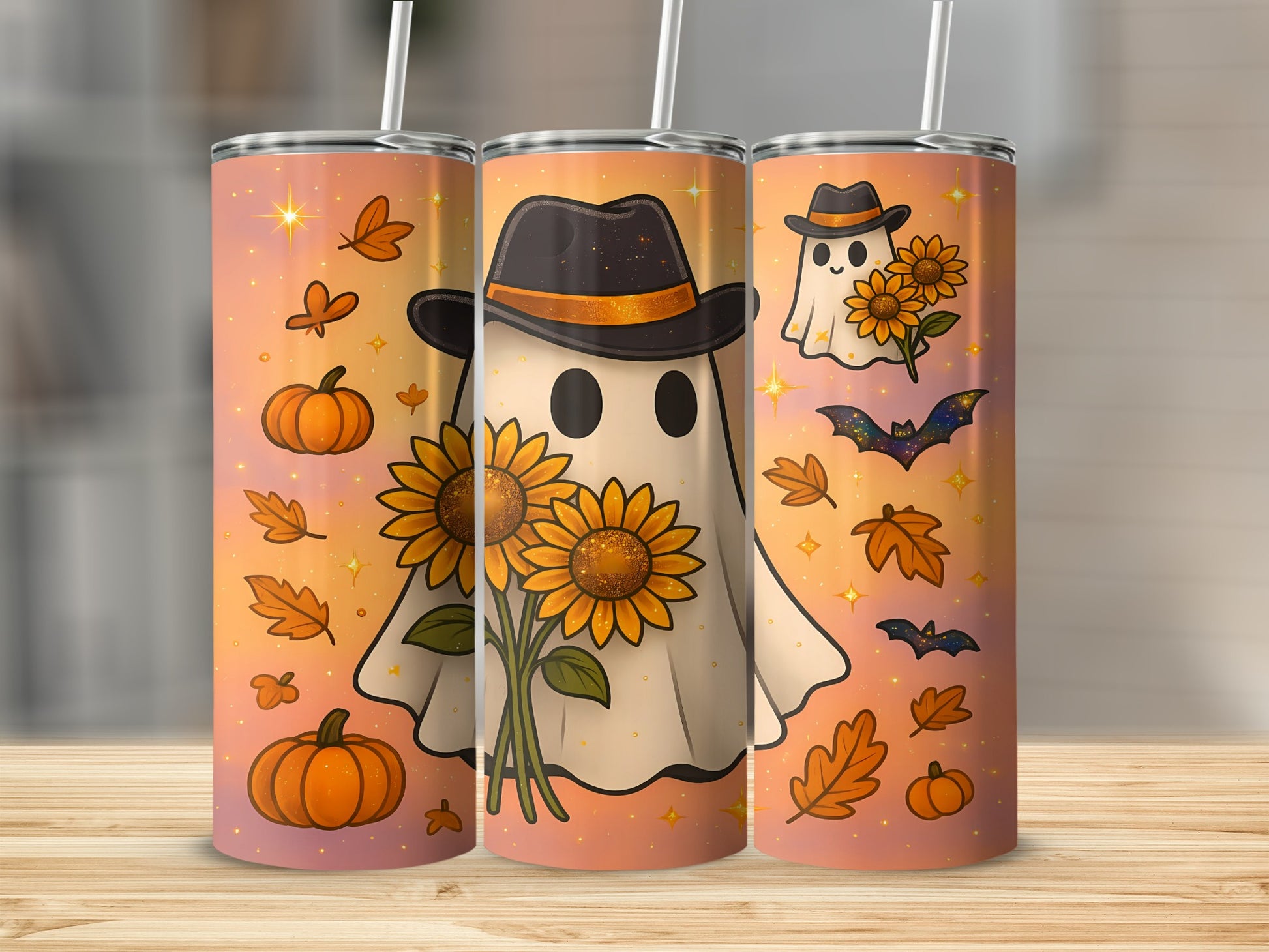 Three tumblers with a Halloween and autumn theme, featuring ghosts, sunflowers, pumpkins, bats, and leaves.