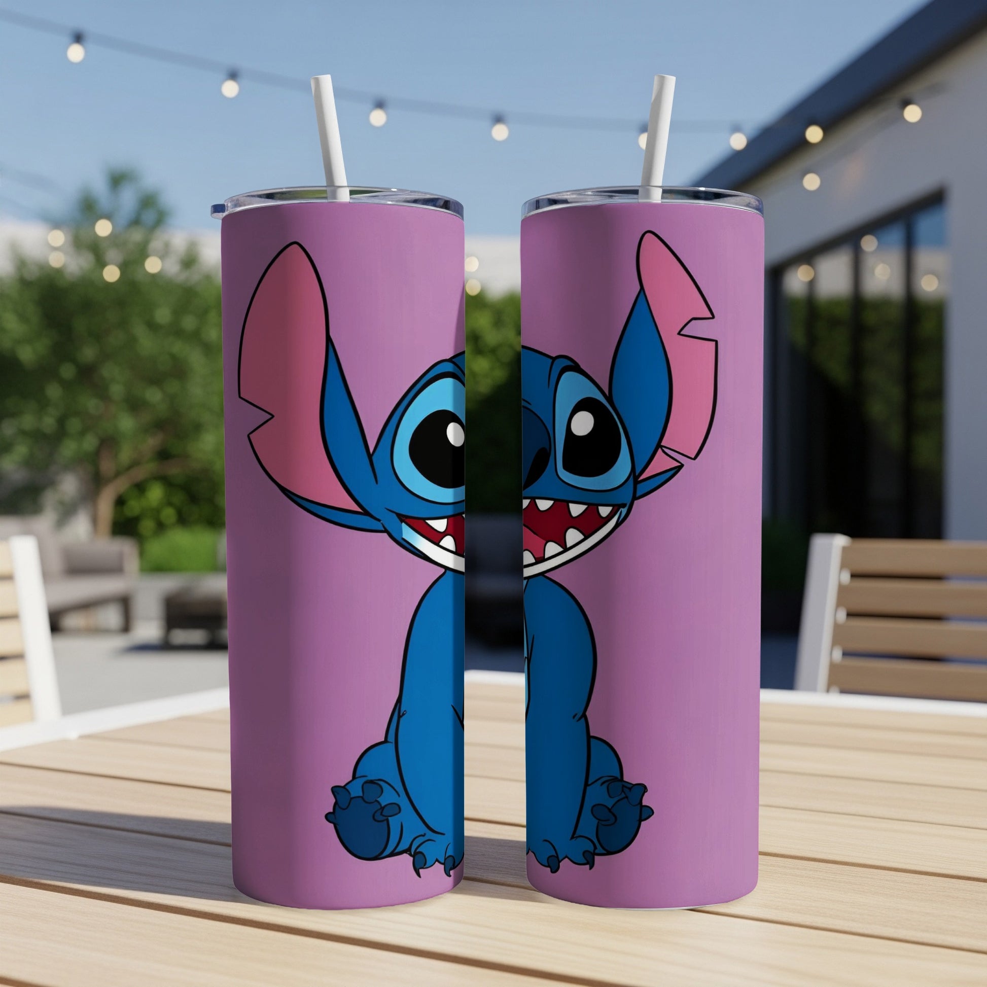 Two purple tumblers featuring Stitch from Lilo & Stitch on a patio table.