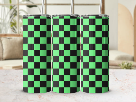 Three green and black checkered tumblers with straws on a marble surface.