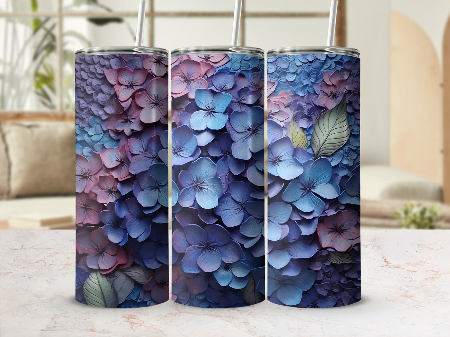 Three tumblers display a close-up floral pattern of blue and purple hydrangeas.