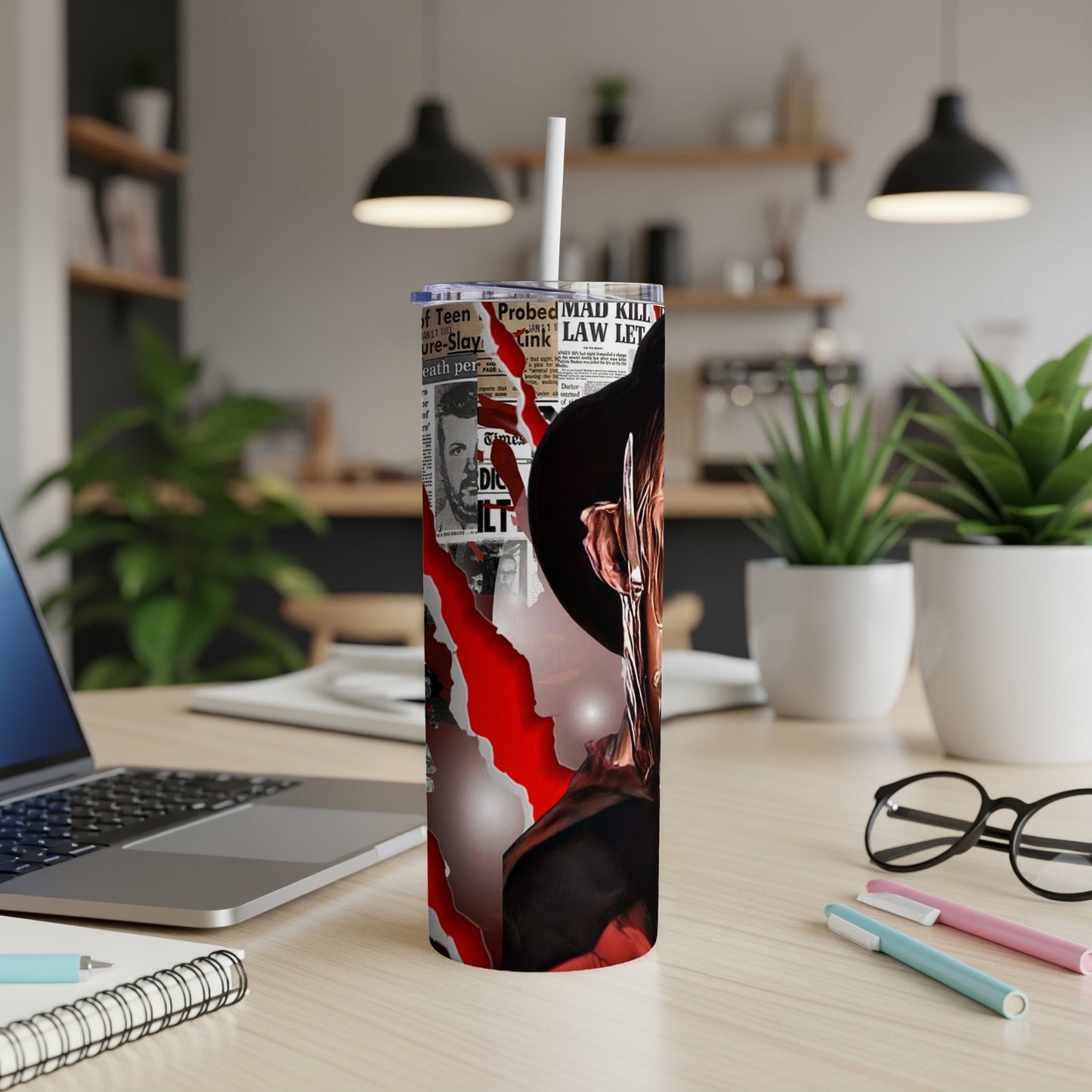 Scary movie themed tumbler with a ripped newspaper collage and a character's face.