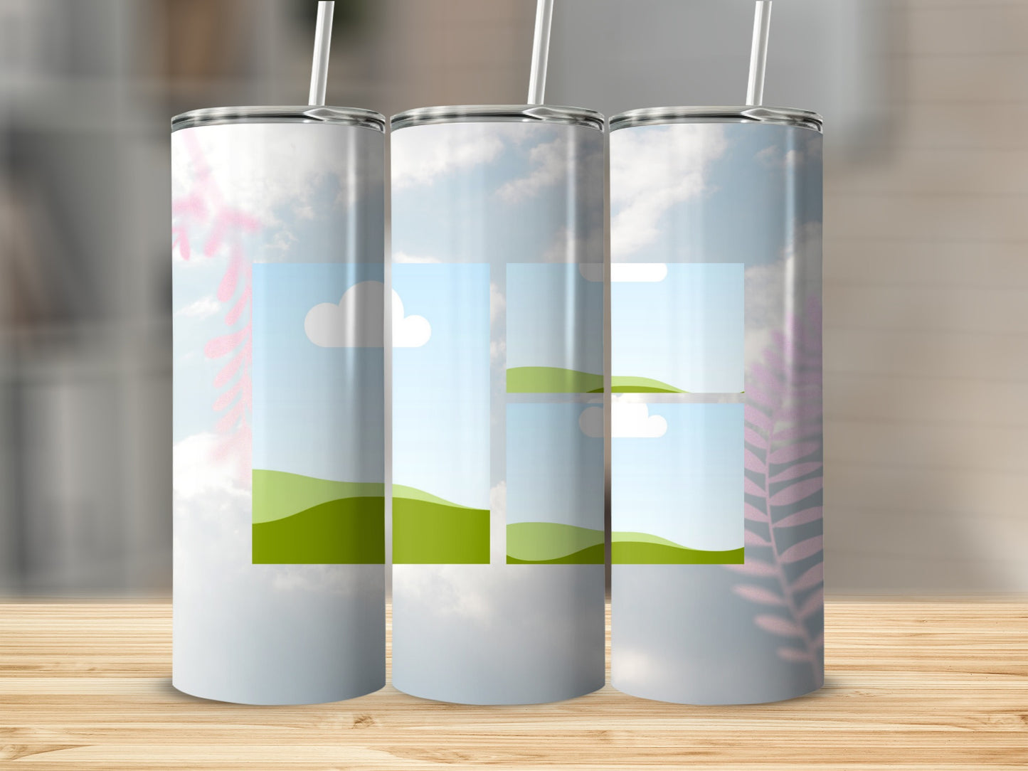 Three tumblers with a sky and rolling green hills design, with pink foliage overlay.